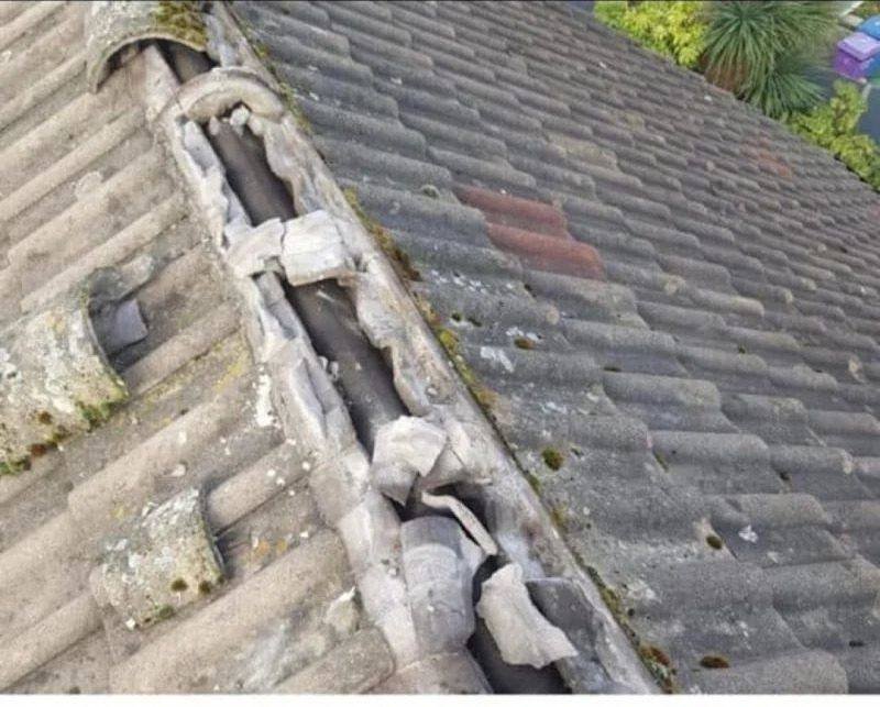 Damaged roof valley before repair